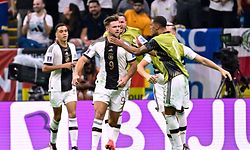 Germany's forward #09 Niclas Fullkrug (2nd L) celebrates with teammantes after scoring his team's first goal during the Qatar 2022 World Cup Group E football match between Spain and Germany at the Al-Bayt Stadium in Al Khor, north of Doha on November 27, 2022. (Photo by JAVIER SORIANO / AFP)