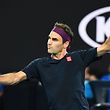 Switzerland's Roger Federer hits a return against Serbia's Novak Djokovic during their men's singles semi-final match on day eleven of the Australian Open tennis tournament in Melbourne on January 30, 2020. (Photo by William WEST / AFP) / IMAGE RESTRICTED TO EDITORIAL USE - STRICTLY NO COMMERCIAL USE