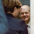 Germany's Social Democratic SPD party co-leader Saskia Esken (C) and German Finance Minister, Vice-Chancellor and the Social Democratic SPD Party's candidate for chancellor Olaf Scholz react in the elevator after a press statement at the headquarters of the SPD in Berlin, on October 6, 2021. - Social Democrats, Greens and German Liberals will begin preliminary discussions on October 7, 2021 in an attempt to form an unprecedented coalition without the conservatives of Angela Merkel, even if the leader of the latter still does not admit defeat. (Photo by Odd ANDERSEN / AFP)