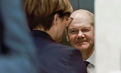 Germany's Social Democratic SPD party co-leader Saskia Esken (C) and German Finance Minister, Vice-Chancellor and the Social Democratic SPD Party's candidate for chancellor Olaf Scholz react in the elevator after a press statement at the headquarters of the SPD in Berlin, on October 6, 2021. - Social Democrats, Greens and German Liberals will begin preliminary discussions on October 7, 2021 in an attempt to form an unprecedented coalition without the conservatives of Angela Merkel, even if the leader of the latter still does not admit defeat. (Photo by Odd ANDERSEN / AFP)