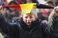 A boy waves a small Belgian flag during the 'March for Unity', a march to support Belgium's unity, 18 November 2007 in Brussels. 165 days after the federal elections of June 2007 demonstrators urge leading politicians to find a solution to form a government without breaking up the country. Several thousand people demonstrated 18 November in Brussels in favour of Belgian unity as a political crisis threatened to tear the country apart into its Dutch and French-speaking communities.   AFP PHOTO / BELGA / BENOIT DOPPAGNE