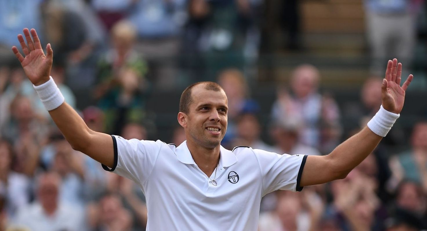 Luxembourg's Gilles Muller reacts after winning against Spain's Rafael Nadal during their men's singles fourth round match on the seventh day of the 2017 Wimbledon Championships at The All England Lawn Tennis Club in Wimbledon, southwest London, on July 10, 2017.
Muller won the match 6-3, 6-4, 3-6, 4-6, 15-13. / AFP PHOTO / Glyn KIRK / RESTRICTED TO EDITORIAL USE