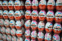 (FILES) A file photo taken November 18, 2014 shows Kinder chocolate eggs at a supermarket in Hanover, central Germany.  - The Italian Ferrero extended, on April 6, 2022, to the United Kingdom and Ireland its "voluntary" recall of Kinder chocolates believed to be at the center of a salmonella outbreak in Europe which affected children days before Easter.  (Photo by Ole SPATA / dpa / AFP) / Germany OUT