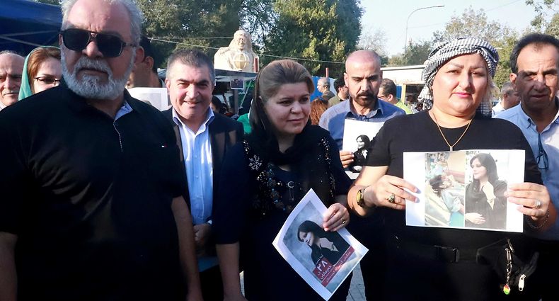 Iranian Kurds participate in a march in a park in the Iraq Kurdish city of Sulaimaniya on September 19, 2022, against the killing of of Mahsa Amini, a woman in Iran who died after being arrested by the Islamic republic's "morality police". - Amini, 22, was on a visit with her family to the Iranian capital when she was detained on September 13 by the police unit responsible for enforcing Iran's strict dress code for women, including the wearing of the headscarf in public. She was declared dead on September 16 by state television after having spent three days in a coma. (Photo by Shwan MOHAMMED / AFP)