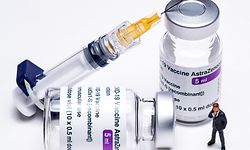 (FILES) In this file photo taken on March 11, 2021 This picture shows vials of the AstraZeneca Covid-19 vaccine, a syringe and a figurine in Paris. - The European Union is very unlikely to renew its Covid-19 vaccine contracts with pharmaceutical company AstraZeneca, a French minister said on April 16, 2021. (Photo by JOEL SAGET / AFP)