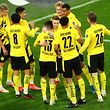Dortmund's Portuguese defender Raphael Guerreiro (C) celebrates scoring the 2-0 goal with his team-mates during the German first division Bundesliga football match Borussia Dortmund vs 1. FC Union, in Dortmund, western Germany, on April 21, 2021. (Photo by CHRISTOF KOEPSEL / various sources / AFP) / DFL REGULATIONS PROHIBIT ANY USE OF PHOTOGRAPHS AS IMAGE SEQUENCES AND/OR QUASI-VIDEO