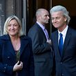 European right-wing politicians Dutchman Geert Wilders, right, and France's Marine Le Pen, left, pose for photographers in The Hague, Wednesday Nov. 13, 2013, prior to meeting for talks likely to focus on next year's European elections. (AP Photo/Peter Dejong)