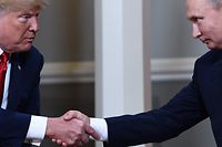 (FILES) In this file photo taken on July 16, 2018, US President Donald Trump (L) and Russian President Vladimir Putin shake hands ahead a meeting in Helsinki.
Trump said on July 19, 2018, he was looking forward to a "second meeting" with Putin after what he called the "great success" of their summit in Helsinki. "The Summit with Russia was a great success, except with the real enemy of the people, the Fake News Media," tweeted Trump, who has come under fire at home for what many saw as his unsettling embrace of the strongman Russian leader.
 / AFP PHOTO / Brendan Smialowski