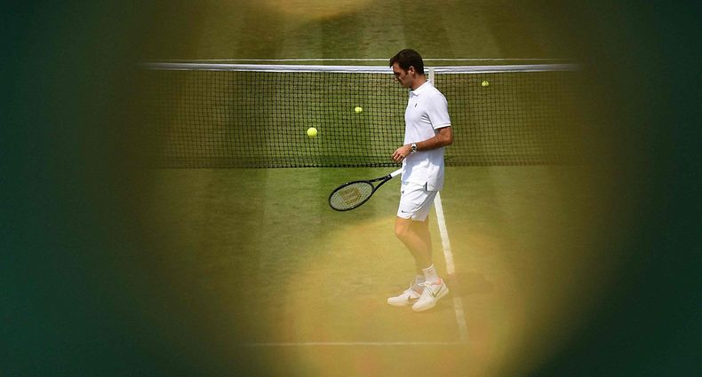 (FILES) In this file photo taken on July 6, 2017 Switzerland's Roger Federer attends a practice session at The All England Lawn Tennis Club in Wimbledon, southwest London, on the fourth day of the 2017 Wimbledon Championships. - Swiss tennis legend Roger Federer is to retire after next week's Laver Cup, he said on September 15, 2022. (Photo by Oli SCARFF / AFP) / RESTRICTED TO EDITORIAL USE
