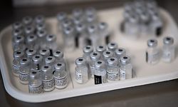 (FILES) This file photograph taken on April 9, 2021, shows vials of the Pfizer/BioNTech Covid-19 vaccine at a vaccination centre set up at an exhibition hall in Nantes, western France. - The EU is turning more heavily to BioNTech/Pfizer to make up for suspended Johnson & Johnson vaccine doses and for longer-term needs to fight the mutating coronavirus, European Commission chief Ursula von der Leyen said April 14, 2021. (Photo by LOIC VENANCE / AFP)