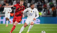 Belgium's midfielder Kevin De Bruyne (L) fights for the ball with France's defender Theo Hernandez during the UEFA Nations League semi-final football match between Belgium and France at the Juventus stadium in Turin, on October 7, 2021. (Photo by FRANCK FIFE / AFP)
