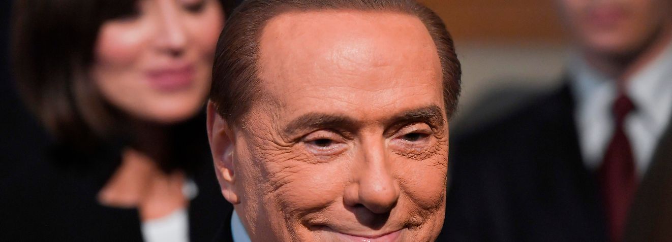 (FILES) In this file photo taken on April 5, 2018 Silvio Berlusconi, leader of the right-wing party "Forza Italia" leaves after a meeting with Italian President Sergio Mattarella on the second day of consultations of political parties, at the Quirinale palace in Rome. - Former Italian prime minister and media tycoon Silvio Berlusconi, 82, was hospitalised in Milan on April 30, 2019, reportedly with kidney stone pain. (Photo by Tiziana FABI / AFP)