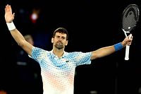 TOPSHOT - Serbia's Novak Djokovic celebrates victory against Russia's Andrey Rublev during their men's singles quarter-final match on day ten of the Australian Open tennis tournament in Melbourne on January 25, 2023. (Photo by DAVID GRAY / AFP) / -- IMAGE RESTRICTED TO EDITORIAL USE - STRICTLY NO COMMERCIAL USE --