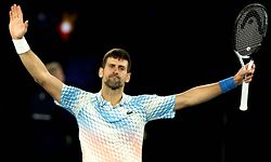 TOPSHOT - Serbia's Novak Djokovic celebrates victory against Russia's Andrey Rublev during their men's singles quarter-final match on day ten of the Australian Open tennis tournament in Melbourne on January 25, 2023. (Photo by DAVID GRAY / AFP) / -- IMAGE RESTRICTED TO EDITORIAL USE - STRICTLY NO COMMERCIAL USE --