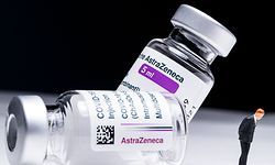 This picture shows vials of the AstraZeneca Covid-19 vaccine and a figurine taken in a studio Paris on March 11, 2021. - European countries can keep using AstraZeneca's coronavirus vaccine during an investigation into cases of blood clots that prompted Denmark, Norway and Iceland to suspend jabs, the EU's drug regulator said on March 11, 2021. (Photo by JOEL SAGET / AFP)