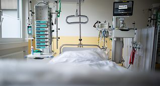An empty bed in a clinic's intensive care unit