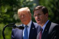 (FILES) In this file photo US Defense Secretary Mark Esper, with US President Donald Trump, speaks on vaccine development on May 15, 2020, in the Rose Garden of the White House in Washington, DC. - President Donald Trump on November 9, 2020 announced by tweet that he had fired his defense secretary Mark Esper, further destabilizing a government already navigating Trump's refusal to concede election defeat to Democrat Joe Biden. "Mark Esper has been terminated. I would like to thank him for his service," Trump said on Twitter, announcing his replacement by Christopher Miller, the current head of the National Counterterrorism Center. (Photo by MANDEL NGAN / AFP)