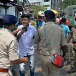 Police detain people who flouted the Covid-19 coronavirus safety protocols of wearing face mask during an awareness drive held in Siliguri on April 25, 2021. (Photo by DIPTENDU DUTTA / AFP)