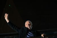 Brazilian former President (2003-2010) and candidate for the leftist Workers Party (PT) Luiz Inacio Lula da Silva greets supporters after learning the results of the legislative and presidential election in Sao Paulo, Brazil, on October 2, 2022. - Brazil's bitterly divisive presidential election will go to a runoff on October 30, electoral authorities said Sunday, as incumbent Jair Bolsonaro beat expectations to finish a relatively close second to front-runner Luiz Inacio Lula da Silva. Lula, the veteran leftist seeking a presidential comeback, had 48.1 percent of the vote to 43.5 percent for the far-right President, with 98 percent of polling stations reporting, according to official from the Superior Electoral Tribunal. (Photo by ERNESTO BENAVIDES / AFP)