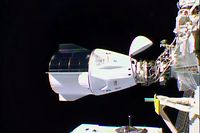 TOPSHOT - This NASA TV video grab shows Nasa's SpaceX Crew-1 mission aboard the SpaceX Crew Dragon (L) docked to the International Space Station (R) on November 16, 2020. - Four astronauts were successfully launched on the SpaceX Crew Dragon "Resilience" to the International Space Station on November 15, the first of what the US hopes will be many routine missions following a successful test flight in late spring. (Photo by - / NASA TV / AFP) / RESTRICTED TO EDITORIAL USE - MANDATORY CREDIT "AFP PHOTO / NASA TV  " - NO MARKETING - NO ADVERTISING CAMPAIGNS - DISTRIBUTED AS A SERVICE TO CLIENTS