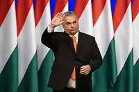 Hungarian Prime Minister and Chairman of the governing Fidesz Party Viktor Orban waves to party members and sympathisers at the end of a national address for the start of the campaign ahead of the upcoming April 2022 general election at the Varkert Bazar cultural centre in Budapest on February 12, 2022. - Prime Minister Viktor Orban is aiming to win a fourth straight term in power, but faces his closest contest since coming to power in 2010 after six opposition parties formed an electoral alliance to try to oust the nationalist strongman. (Photo by Attila KISBENEDEK / AFP)
