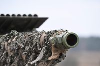 The barrel of a Leopard 2 cannon is seen at the training ground in Augustdorf, western Germany on February 1, 2023, during a visit of the German Defence Minister of the Bundeswehr Tank Battalion 203, to learn about the performance of the Leopard 2 main battle tank. (Photo by INA FASSBENDER / AFP)
