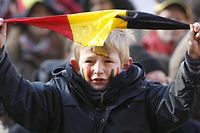 A boy waves a small Belgian flag during the 'March for Unity', a march to support Belgium's unity, 18 November 2007 in Brussels. 165 days after the federal elections of June 2007 demonstrators urge leading politicians to find a solution to form a government without breaking up the country. Several thousand people demonstrated 18 November in Brussels in favour of Belgian unity as a political crisis threatened to tear the country apart into its Dutch and French-speaking communities.   AFP PHOTO / BELGA / BENOIT DOPPAGNE