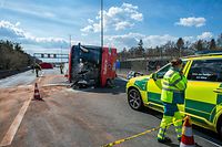 Emergency services stand at the scene of a traffic accident involving a coach bus on the E19 highway in Sint-Job-in-'t-Goor, Brecht on April 10, 2022. (Photo by JONAS ROOSENS / BELGA / AFP) / Belgium OUT