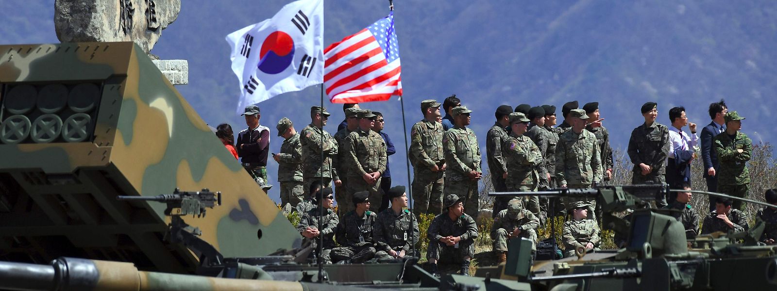 (FILES) This file photo taken on April 26, 2017 shows South Korean and US soldiers watching from an observation post during a joint live firing drill between South Korea and the US at the Seungjin Fire Training Field in Pocheon, 65 kms northeast of Seoul.
The US military has indefinitely postponed major joint exercises with South Korea, an official told AFP on June 14, 2018, acting on President Donald Trump's pledge to halt the "provocative" military drills following his summit with North Korea's Kim Jong Un. / AFP PHOTO / JUNG Yeon-Je