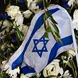 A photo taken on August 17, 2022 shows a wreath with an Israeli flag at the memorial site 'Erinnerungsort Olympia-Attentat' (Place of remembrance of the Olympic attack) at the Olympic Park in Munich, southern Germany. - On September 5, 1972, eight gunmen of the Palestinian militant group Black September broke into the Israeli team's flat at the Olympic Village in Munich, shooting dead two and taking nine Israelis hostage. West German police responded with a bungled rescue operation in which all nine hostages were killed, along with five of the eight hostage-takers and a German police officer. The Games were meant to showcase a new Germany 27 years after the Holocaust but instead opened a deep rift with Israel. (Photo by INA FASSBENDER / AFP)