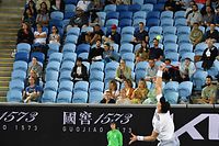 Fans watch as South Africa's Kevin Anderson serves against Italy's Matteo Berrettini during their men's singles match on day two of the Australian Open tennis tournament in Melbourne on February 9, 2021. (Photo by Paul CROCK / AFP) / -- IMAGE RESTRICTED TO EDITORIAL USE - STRICTLY NO COMMERCIAL USE --