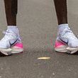 (FILES) This file photograph taken on October 12, 2019, shows the running shoes of Kenya's Eliud Kipchoge as he stands after his attempt to break the two-hour barrier for the marathon at The Reichsbr�cke in Vienna, - The suspicion that World Athletics could ban Nike's Vaporfly shoes over fears they give runners an unfair edge gave a boost to the performance of some rivals. A World Athletics spokeswoman said January 16, 2020, that a committee composed of officials, athletes, doctors, scientists and legal experts, was still looking at the shoes, which athletes have worn to set a string of records in recent months, but is expected to make recommendations by the end of January. "The panel is still deliberating but we hope to be able to make an announcement by the end of the month," the spokeswoman told AFP, adding that any changes to the rules would then have to be approved by the International Federation Council. (Photo by ALEX HALADA / AFP)