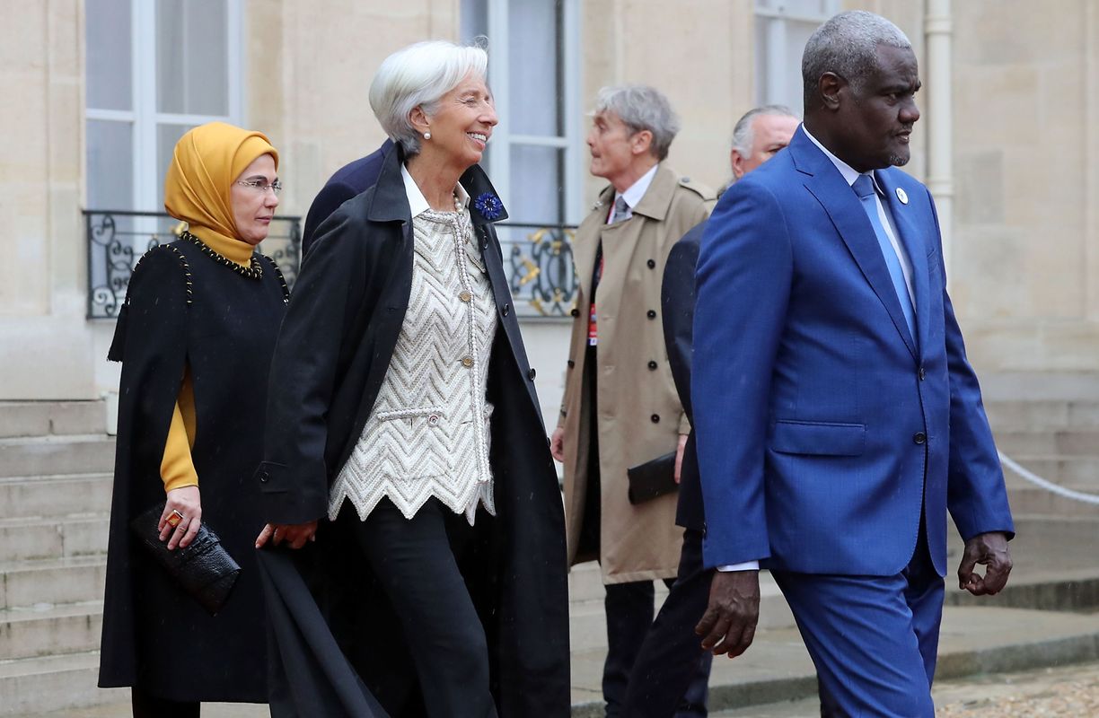 Turkish President's wife Emine Erdogan (L), the Director of the International Monetary Fund (IMF) Christine Lagarde and the Chairman of the African Union (AU) Moussa Faki Mahamat (R) leave the Elysee Palace in Paris on November 11, 2018 for the Arc de Triomphe prior to the start of commemorations marking the 100th anniversary of the 11 November 1918 armistice, ending World War I. (Photo by JACQUES DEMARTHON / AFP)