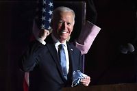 (FILES) In this file photo taken on November 4, 2020 Democratic presidential nominee Joe Biden gestures as he arrives onstage to address supporters during election night at the Chase Center in Wilmington, Delaware. - Joe Biden has won the US presidency over Donald Trump, TV networks projected on November 7, 2020, a victory sealed after the Democrat claimed several key battleground states won by the Republican incumbent in 2016. CNN, NBC News and CBS News called the race in his favor, after projecting he had won the decisive state of Pennsylvania. His running mate, US Senator Kamala Harris, has become the first woman US Vice President elected to the office. (Photo by Roberto SCHMIDT / AFP)