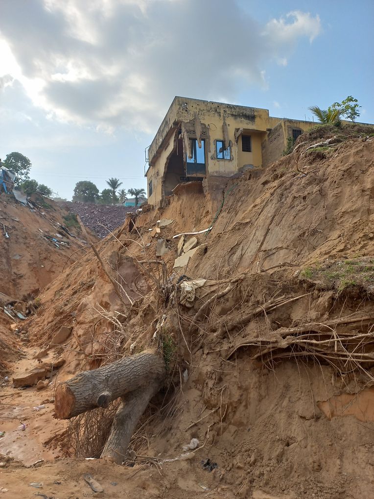 The rains have carved out new rivers.  The houses on the edge can collapse at any time.