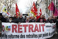 (FILES) In this file photo taken on March 3, 2020 general Secretary of French Union CGT Philippe Martinez (C) takes part in a demonstration in Marseille, southern France,after French Prime minister announced the use of Article 49.3 of the Constitution, allowing the government to bypass parliament on the contested pensions reform bill. - The day of mobilization against the pension reform called by the unions on January 19, 2023 is expected to be "very strong", predicted on January 15, 2023 several opponents of the government project. (Photo by Pascal POCHARD-CASABIANCA / AFP)