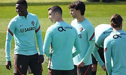 Portugal's forward Cristiano Ronaldo (C,L) and forward Joao Felix (C,R)  take part in a training session on the eve of the FIFA World Cup 2022 qualifying football match Portugal Vs Azerbaijan on March 23, 2021 at the 'Juventus Training Center' in Turin. (Photo by MARCO BERTORELLO / AFP)