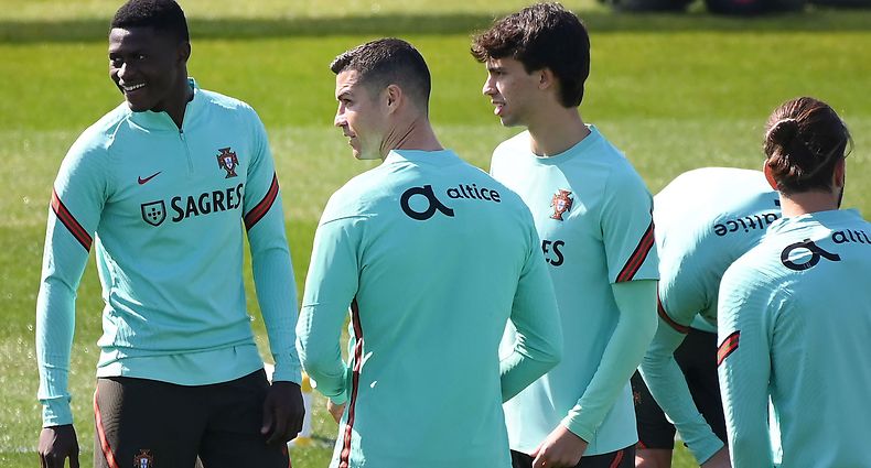 Portugal's forward Cristiano Ronaldo (C,L) and forward Joao Felix (C,R)  take part in a training session on the eve of the FIFA World Cup 2022 qualifying football match Portugal Vs Azerbaijan on March 23, 2021 at the 'Juventus Training Center' in Turin. (Photo by MARCO BERTORELLO / AFP)