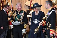 Britain's Prince Charles, Prince of Wales (centre left) and Britain's Camilla, Duchess of Cornwall (centre right) depart through the Sovereign's Entrance after attending the State Opening of Parliament at the Houses of Parliament, in London, on May 10, 2022. - Queen Elizabeth II will miss Tuesday's ceremonial opening of Britain's parliament, as Prime Minister Boris Johnson tries to reinvigorate his faltering government by unveiling its plans for the coming year. (Photo by Chris Jackson / POOL / AFP)