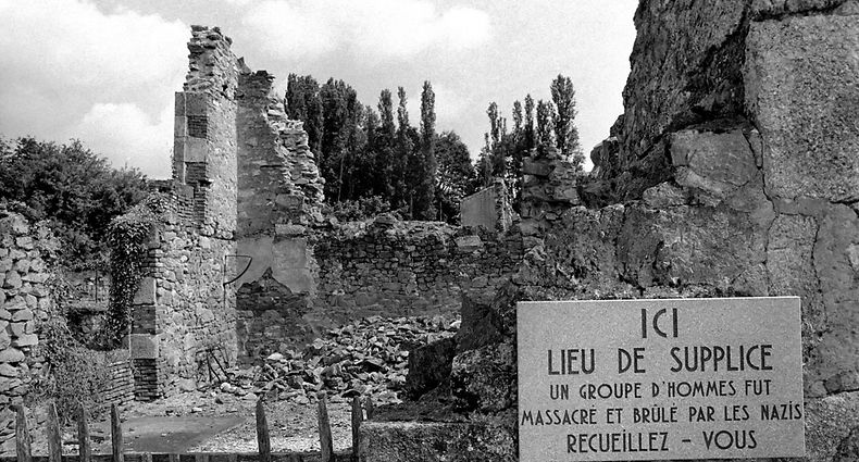 The village remains unchanged since that day, with damaged buildings, the wreck of a car from which the mayor was dragged as a reminder and memorial of the past. June 1980 80-03006-015 (Photo by WATFORD/Mirrorpix/Mirrorpix via Getty Images)