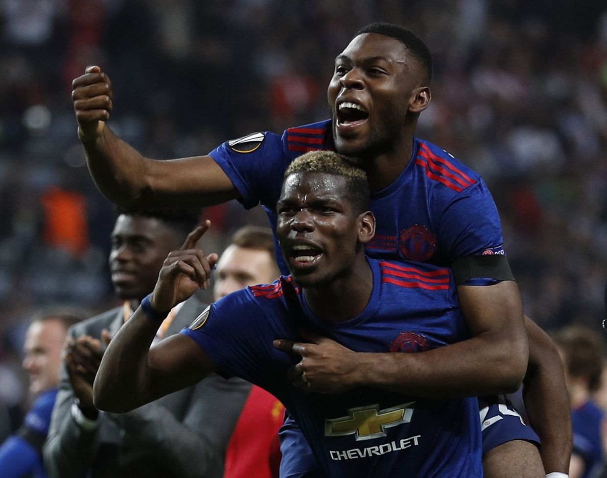 Football Soccer - Ajax Amsterdam v Manchester United - UEFA Europa League Final - Friends Arena, Solna, Stockholm, Sweden - 24/5/17 Manchester United's Timothy Fosu-Mensah and Paul Pogba celebrate winning the Europa League Reuters / Lee Smith Livepic