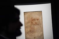 A visitor views the "Portrait of a man in red chalk" (circa 1510), widely accepted as a self portrait of Leonardo da Vinci, during the exhibition "Leonardo da Vinci. Designing the future" at the Galleria Sabauda on April 15, 2019 in Turin. - Leonardo�s self-portrait will be at the center of an exhibition that the Royal Museums inaugurate on April 15, 2019, the day of the artist�s birth. The exhibition celebrates the 500th anniversary of Leonardo�s death and shows until July 14, the collection of 13 autograph drawings and the Code on the Flight of Birds. (Photo by Marco BERTORELLO / AFP) / RESTRICTED TO EDITORIAL USE - MANDATORY MENTION OF THE ARTIST UPON PUBLICATION - TO ILLUSTRATE THE EVENT AS SPECIFIED IN THE CAPTION