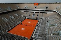 (FILES) This file photo taken on June 4, 2019,  shows a general  view of the empty Philippe Chatrier court during rain, during the men's singles quarter-final match between Spain's Rafael Nadal and Japan's Kei Nishikori, on day ten of The Roland Garros 2019 French Open tennis tournament in Paris. - The Roland Garros French Open tennis tournament, originally scheduled for May 24 to June 7, 2020, has been postponed to run from September 20 to October 4, 2020, due to the outbreak of COVID-19, caused by the novel coronavirus, the French Tennis Federation (FFT) announced on March 17, 2020. (Photo by Thomas SAMSON / AFP)