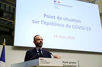 French Prime Minister Edouard Philippe delivers a speech to announce new measures to limit the spread of COVID-19, the new coronavirus, on March 14, 2020, in Paris. - The French prime minister announced the closure of all "places receiving public that are not essential to the life of the country", calling on the French to "more discipline" in the face of the coronavirus pandemic. Restaurants, bars, discotheques and cinemas are called on to close their doors. Businesses are also affected, with the exception of food stores, pharmacies, banks, tobacconists and petrol stations. (Photo by Thomas SAMSON / AFP)