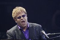 Singer Elton John performs at a  charity concert dedicated to the fight against HIV/AIDS at Independence Square in Kiev June 30, 2012. REUTERS/Gleb Garanich (UKRAINE - Tags: ENTERTAINMENT)