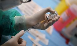A medical worker fills a syringe from a vial of the British-Swedish AstraZeneca/Oxford vaccine during a vaccination campaign on March 9, 2021 at the National Museum of Science and Technology Leonardo Da Vinci, which is currently hosting the anti-Covid vaccination campaign with Multimedica in Milan. (Photo by Miguel MEDINA / AFP)