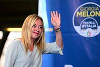 Leader of Italian far-right party Fratelli d'Italia (Brothers of Italy) Giorgia Meloni waves to supporters during a rally to launch her campaign for general elections, in Ancona, central Italy, on August 23, 2022. - Italians head to the polls for general elections on September 25, 2022. Opinion polls put Giorgia Meloni's post-fascist Brothers on course to lead the eurozone's third largest economy, in a coalition with the ex-premier's Forza Italia and the anti-immigration Lega. (Photo by Vincenzo PINTO / AFP)