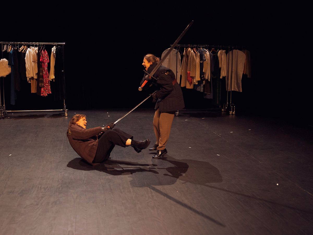 A sword fight (a scene from Macbeth) between Kim Birel (as Rosalind) and Gina Millington (as Charlie)