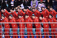 North Korea's cheerleaders cheer during the women's preliminary round ice hockey match between Switzerland and the Unified Korean team during the Pyeongchang 2018 Winter Olympic Games at the Kwandong Hockey Centre in Gangneung on February 10, 2018.   / AFP PHOTO / JUNG Yeon-Je