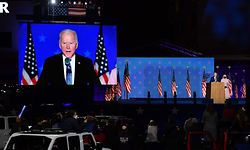 Supporters of Democratic presidential nominee Joe Biden listen to him speak, next to his wife Jill Biden, during election night at the Chase Center in Wilmington, Delaware, early on November 4, 2020. - Democrat Joe Biden said early Wednesday he believes he is "on track" to defeating US President Donald Trump, and called for Americans to have patience with vote-counting as several swing states remain up in the air.
"We believe we are on track to win this election," Biden told supporters in nationally broadcast remarks delivered in his home city of Wilmington, Delaware, adding: "It ain't over until every vote is counted." (Photo by ANGELA WEISS / AFP)